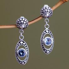 Blue Topaz and Sterling Silver Dangle Earrings, 'Reflections in Blue'